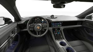 Interior view showing the steering wheel and dashboard of Taycan 4 Black Edition
