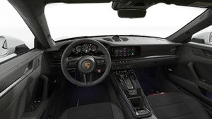 Interior view showing the steering wheel and dashboard of 911 Carrera GTS