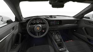 Interior view showing the steering wheel and dashboard of 911 Carrera 4 GTS