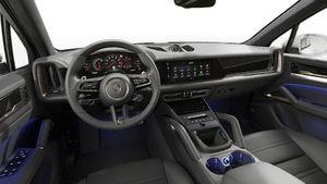 Interior view showing the steering wheel and dashboard of Cayenne Turbo E-Hybrid