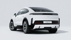 Exterior view of Cayenne Turbo Coupé Electric showing the back and left side of the car