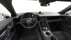 Interior view showing the steering wheel and dashboard of Taycan GTS