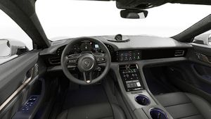 Interior view showing the steering wheel and dashboard of Taycan Turbo