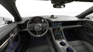 Vista interior que muestra el volante y el salpicadero de Taycan Turbo S