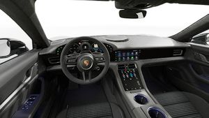 Vue de l'intérieur montrant le volant et le tableau de bord d'un véhicule de transport de marchandises. Taycan 4 Black Edition