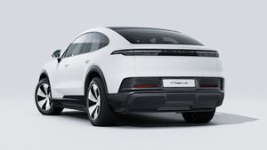 Exterior view of Cayenne Coupé Electric showing the back and left side of the car