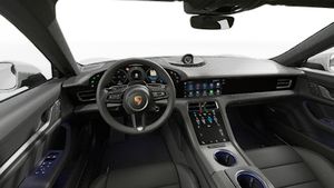 Interior view showing the steering wheel and dashboard of Taycan