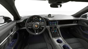 Interior view showing the steering wheel and dashboard of Taycan 4 Black Edition