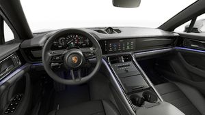 Interior view showing the steering wheel and dashboard of Panamera 4 E-Hybrid