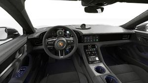 Interior view showing the steering wheel and dashboard of Taycan Turbo GT