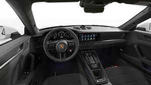 Interior view showing the steering wheel and dashboard of 911 Carrera GTS