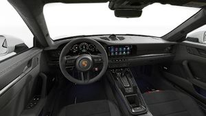 Interior view showing the steering wheel and dashboard of 911 Carrera 4 GTS