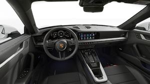 Interior view showing the steering wheel and dashboard of 911 Carrera 4S