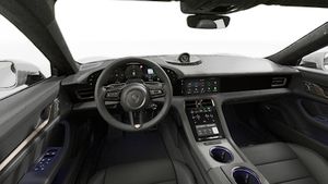 Interior view showing the steering wheel and dashboard of Taycan Turbo