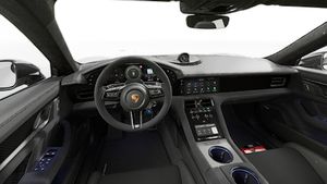 Interior view showing the steering wheel and dashboard of Taycan Turbo GT