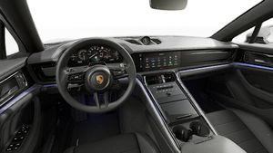 Interior view showing the steering wheel and dashboard of Panamera 4 E-Hybrid