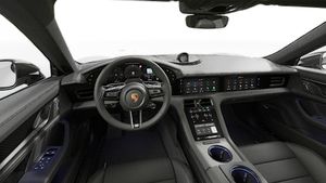 Vue de l'intérieur montrant le volant et le tableau de bord d'un véhicule de transport de marchandises. Taycan 4S Black Edition