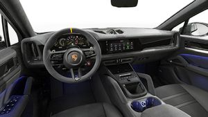 Pogled iz unutrašnjosti koji prikazuje volan i kontrolnu tablu modela Cayenne Turbo E-Hybrid Coupé with GT Package
