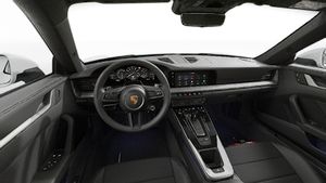Interior view showing the steering wheel and dashboard of 911 Carrera