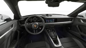 Interior view showing the steering wheel and dashboard of 911 Carrera