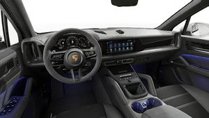 Interior view showing the steering wheel and dashboard of Cayenne GTS
