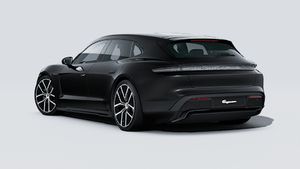Pohľad zvonku na Taycan Sport Turismo Black Edition zobrazujúci zadnú a ľavú stranu vozidla