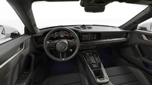 Interior view showing the steering wheel and dashboard of 911 Turbo S