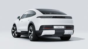 Exterior view of Cayenne S Coupé Electric showing the back and left side of the car
