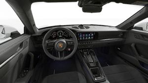 Interior view showing the steering wheel and dashboard of 911 Carrera GTS