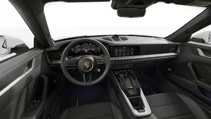 Interior view showing the steering wheel and dashboard of 911 Carrera S