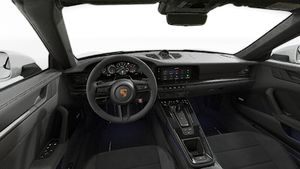 Interior view showing the steering wheel and dashboard of 911 Carrera 4 GTS Cabriolet