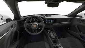 Interior view showing the steering wheel and dashboard of 911 Carrera 4 GTS Cabriolet