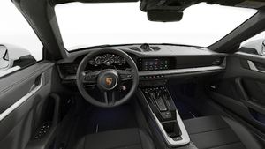 Interior view showing the steering wheel and dashboard of 911 Carrera 4S Cabriolet
