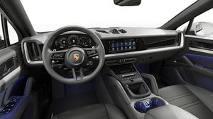Interior view showing the steering wheel and dashboard of Cayenne Coupe