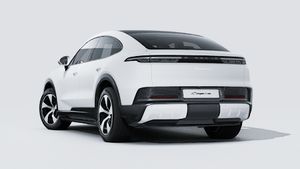 Exterior view of Cayenne S Coupé Electric showing the back and left side of the car