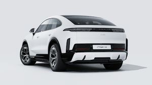 Exterior view of Cayenne Turbo Coupé Electric showing the back and left side of the car