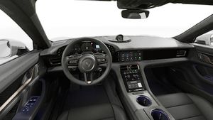Interior view showing the steering wheel and dashboard of Taycan Turbo S