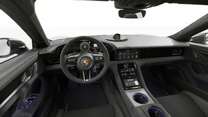 Interior view showing the steering wheel and dashboard of Taycan Turbo GT