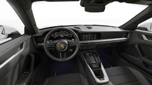 Interior view showing the steering wheel and dashboard of 911 Carrera