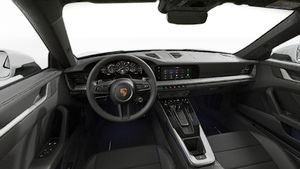 Interior view showing the steering wheel and dashboard of 911 Carrera S