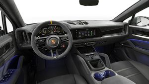 Interior view showing the steering wheel and dashboard of Cayenne Turbo GT