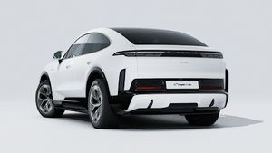Exterior view of Cayenne Turbo Coupe Electric showing the back and left side of the car