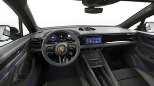 Interior view showing the steering wheel and dashboard of Macan GTS