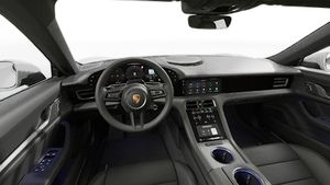 Interior view showing the steering wheel and dashboard of Taycan 4S