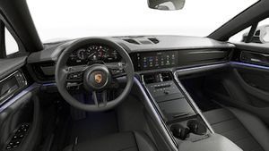 Interior view showing the steering wheel and dashboard of Panamera