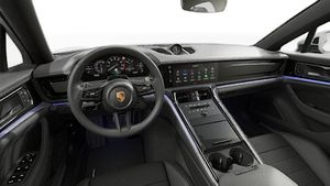 Interior view showing the steering wheel and dashboard of Panamera 4 E-Hybrid