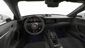 Interior view showing the steering wheel and dashboard of 911 Carrera GTS