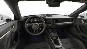 Interior view showing the steering wheel and dashboard of 911 Turbo S