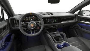 Interior view showing the steering wheel and dashboard of Cayenne Turbo GT