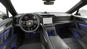 Interior view showing the steering wheel and dashboard of Cayenne Coupé Electric